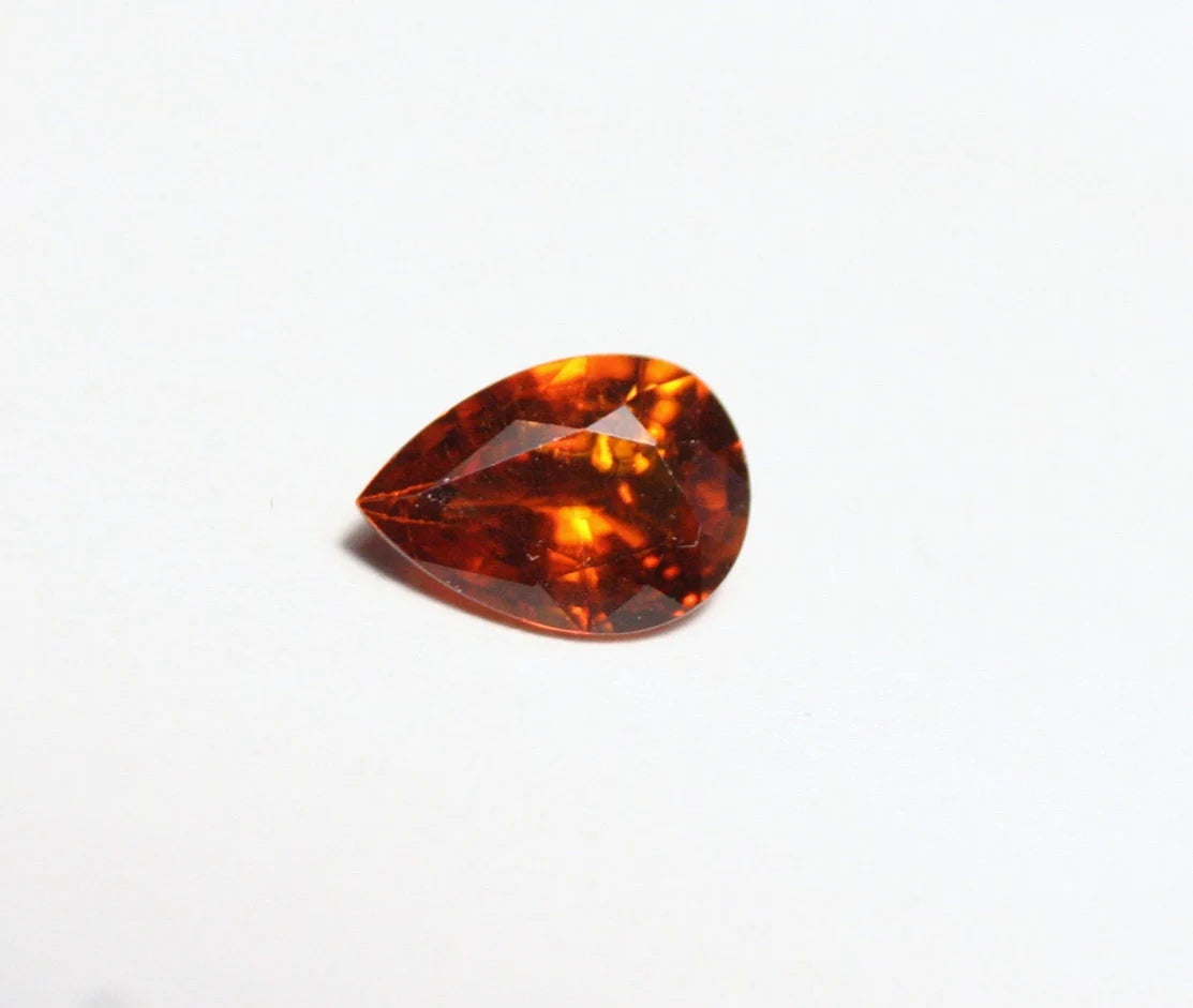 Clinohumite 0.7ct Ultra Rare Orange / Red Faceted Gem Pakistan 7x5mm