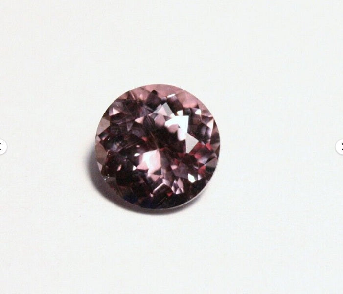 Colour Change Garnet 1.17ct Round Cut Rare Scintillating Gem Tanzania 6x6mm AAA