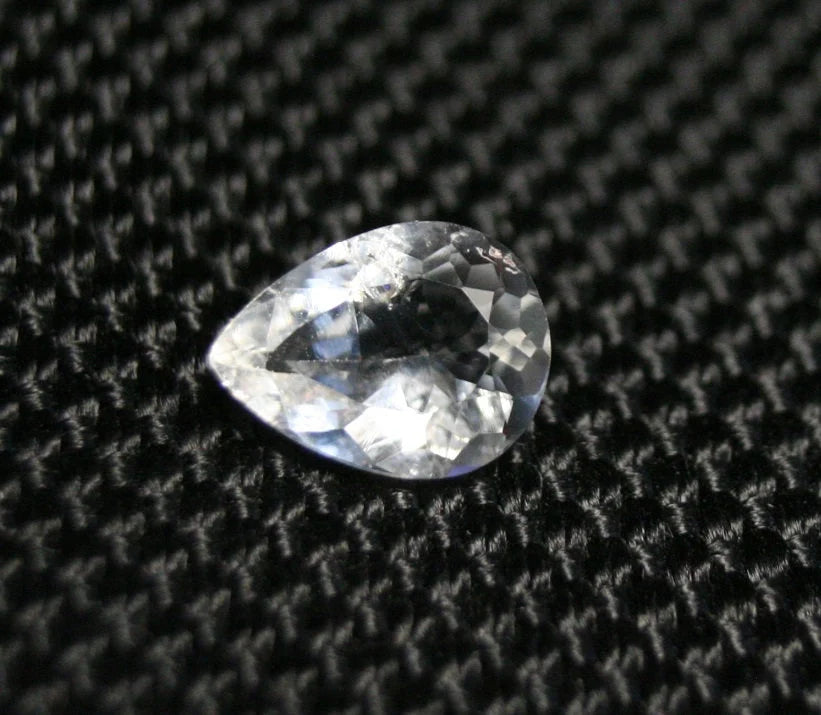 Tanzanian Colourless Scapolite 0.9ct Rare Fluorescent Cut Gem 8x6mm