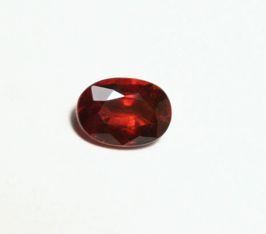 Clinohumite 0.71ct Ultra Rare Deep Orange / Red Faceted Gem - Pakistan 7x4mm