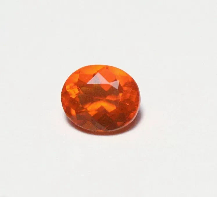 Faceted Orange Mexican Fire Opal 0.7ct Oval Cut Natural Opalescent 7x5mm