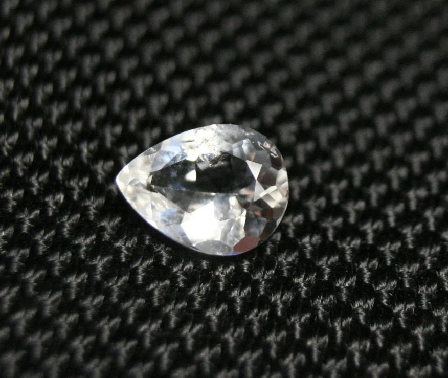 Tanzanian Colourless Scapolite 0.9ct Rare Fluorescent Cut Gem 8x6mm