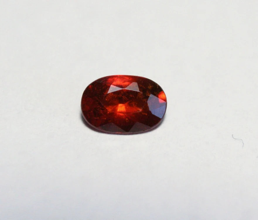 Clinohumite 0.56ct Ultra Rare Deep Orange / Red Faceted Gem - Pakistan 6x4mm