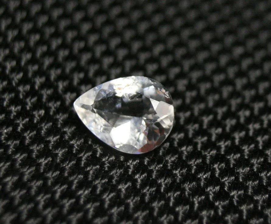 Tanzanian Colourless Scapolite 0.9ct Rare Fluorescent Cut Gem 8x6mm