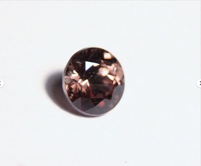 Colour Change Garnet 0.8ct Round Cut Rare Scintillating Gem Tanzania 5x5mm AAA