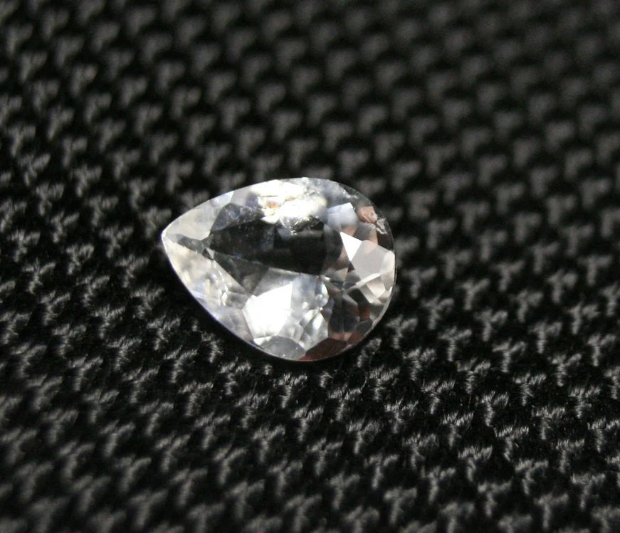 Tanzanian Colourless Scapolite 0.9ct Rare Fluorescent Cut Gem 8x6mm