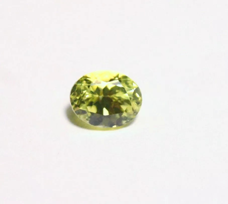 Burmese Chrysoberyl 0.69ct Rare Neon Yellow AAA Scintillating Oval Cut 5.5x4mm