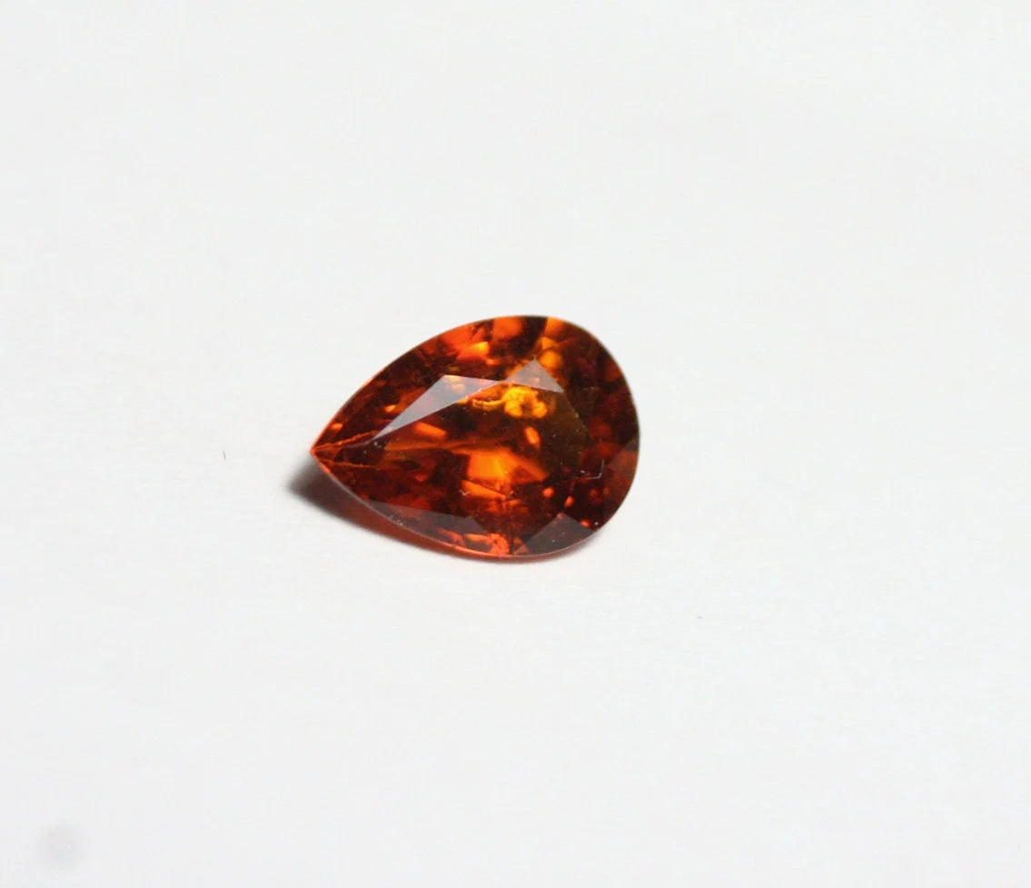 Clinohumite 0.7ct Ultra Rare Orange / Red Faceted Gem Pakistan 7x5mm