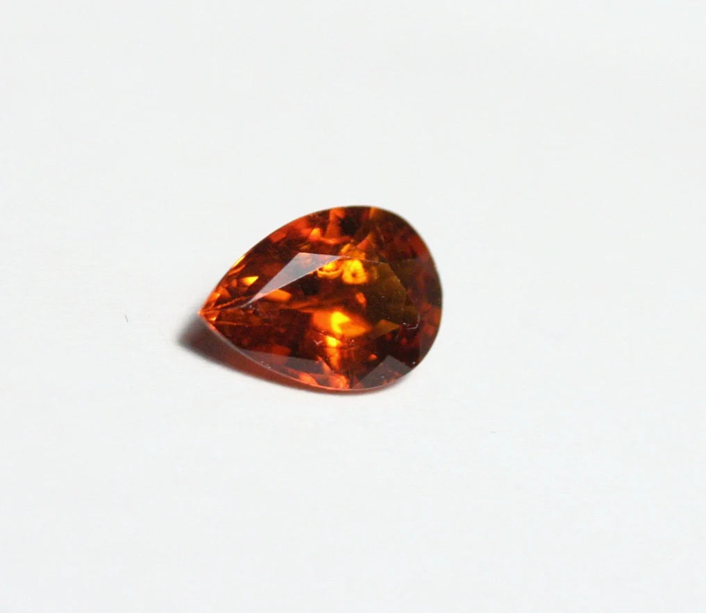 Clinohumite 0.7ct Ultra Rare Orange / Red Faceted Gem Pakistan 7x5mm