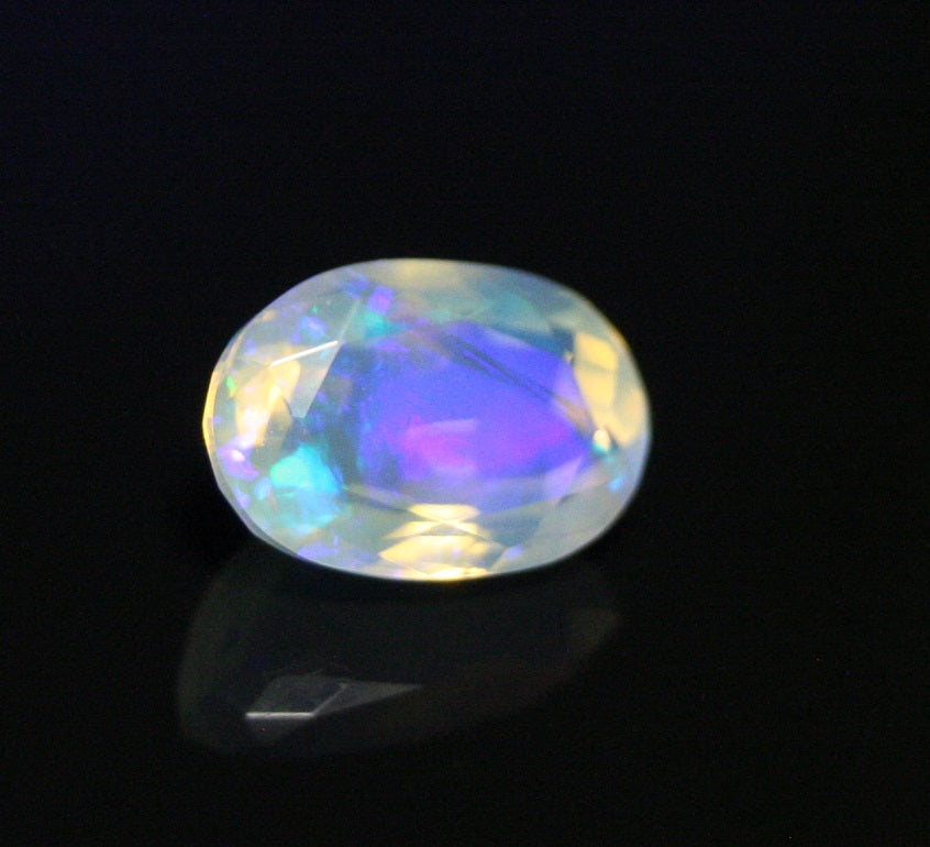 Faceted Welo Opal 1.38ct Neon Violet AAA Natural Crystal Jelly Opal 10x7mm - See Video