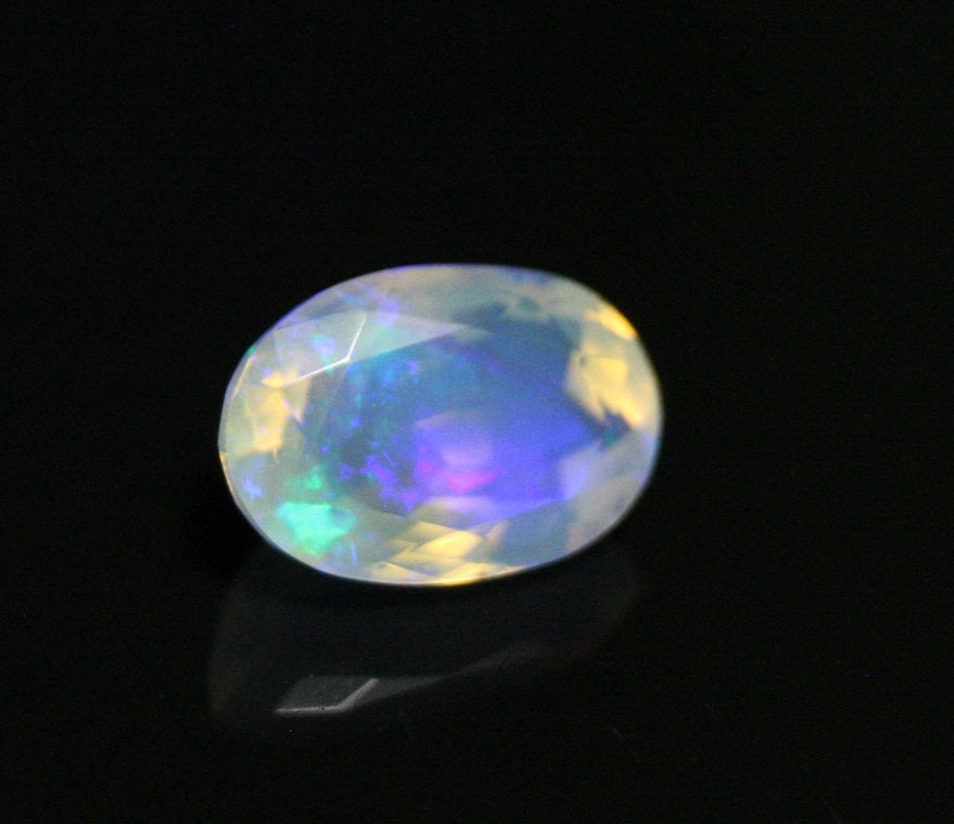 Faceted Welo Opal 1.38ct Neon Violet AAA Natural Crystal Jelly Opal 10x7mm - See Video