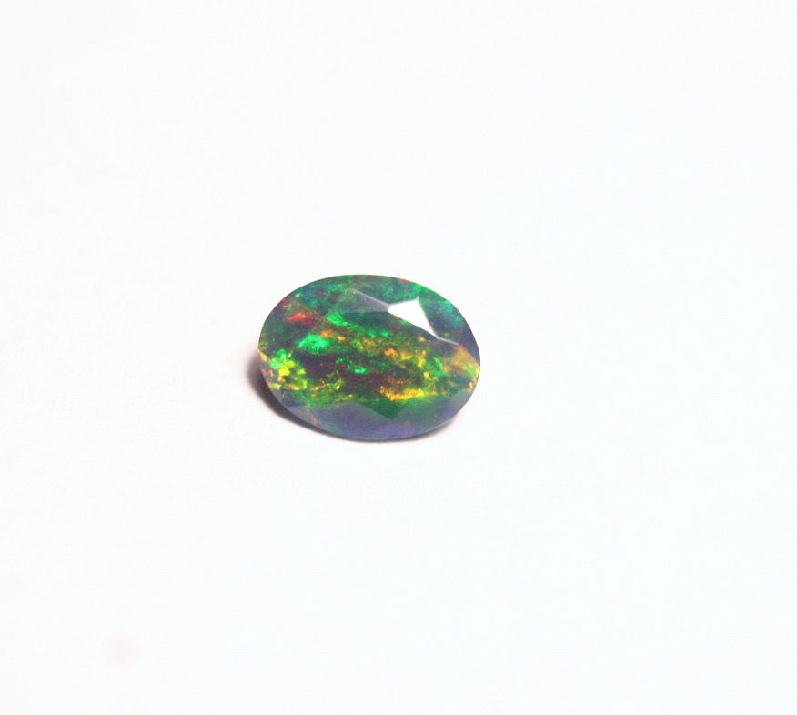 0.7ct Faceted Black Natural Welo Opal Stunning Neon Rainbow Flash AAA Jelly Opal