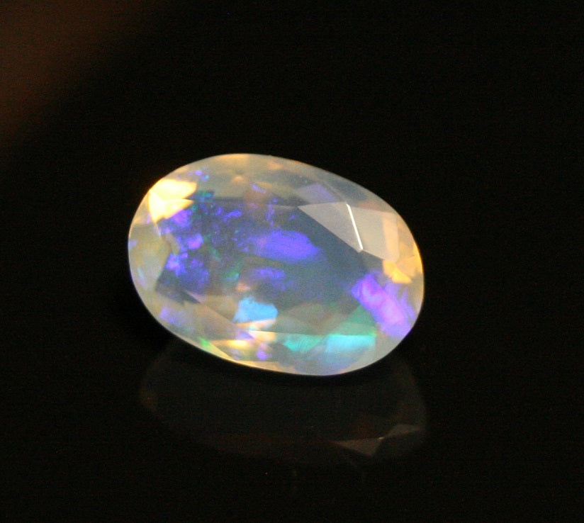 Faceted Welo Opal 1.38ct Neon Violet AAA Natural Crystal Jelly Opal 10x7mm - See Video