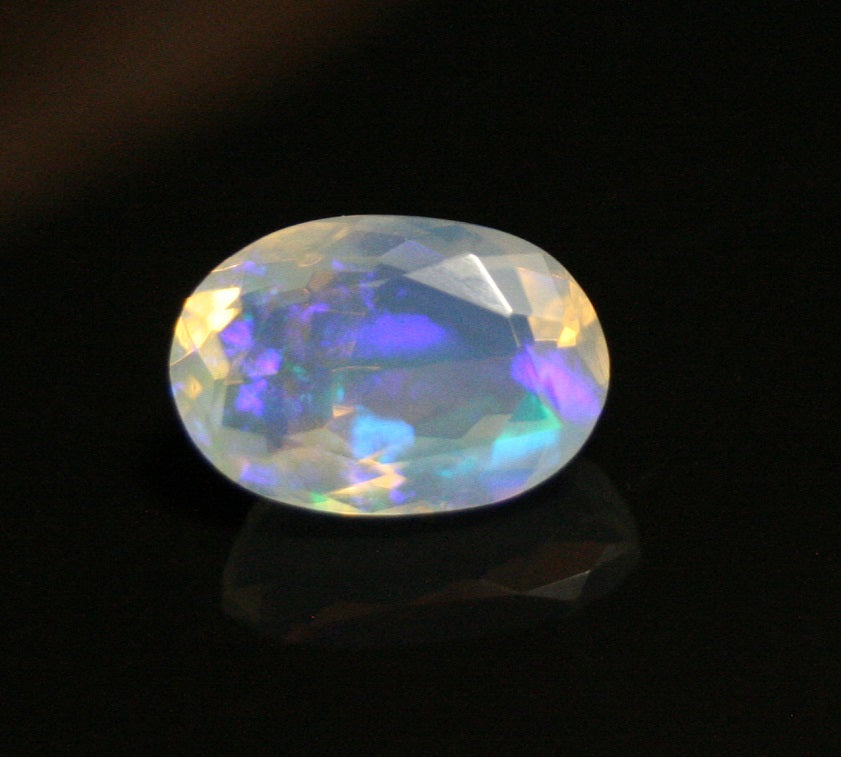 Faceted Welo Opal 1.38ct Neon Violet AAA Natural Crystal Jelly Opal 10x7mm - See Video